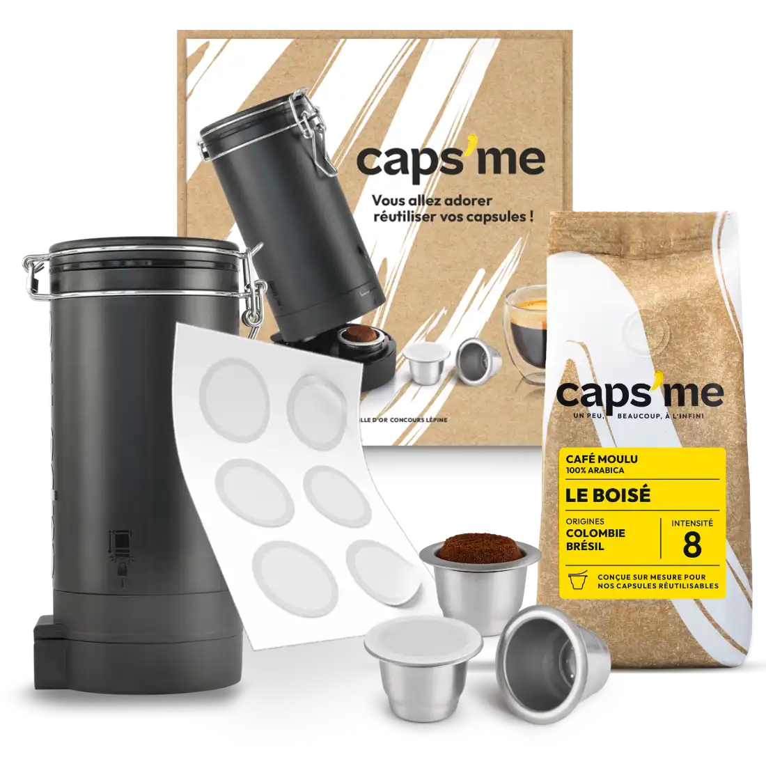 Coffee capsule kit with reusable capsules, ground coffee, and storage container.